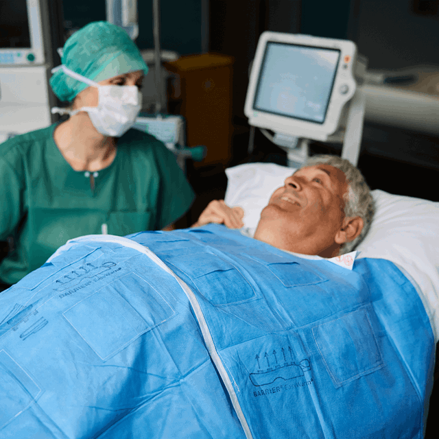 A photo of a surgeon talking to a patient before surgery.  